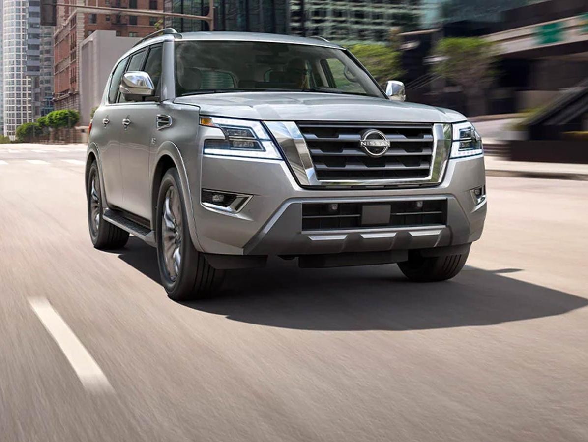 Nissan Armada Cruising on City Road
