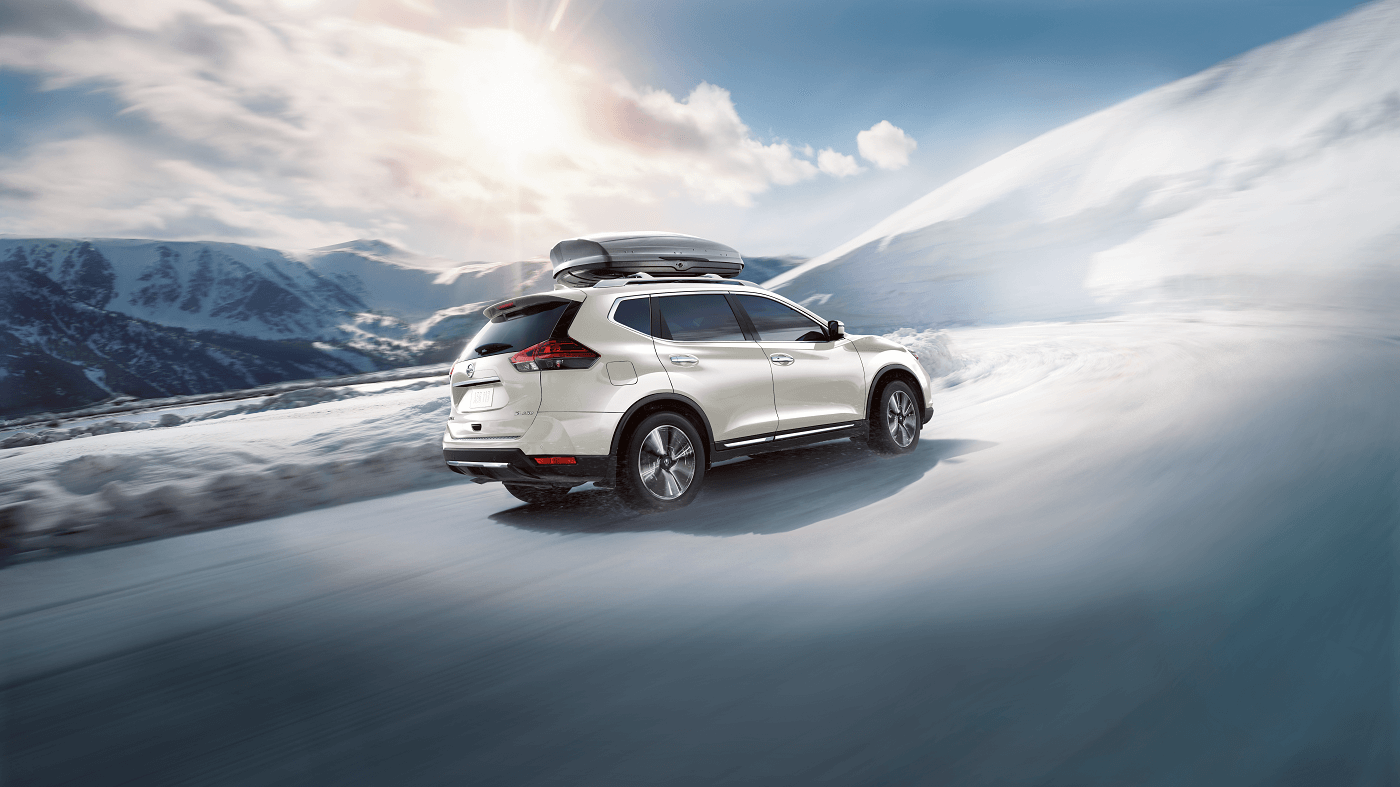 Nissan Rouge driving on snow