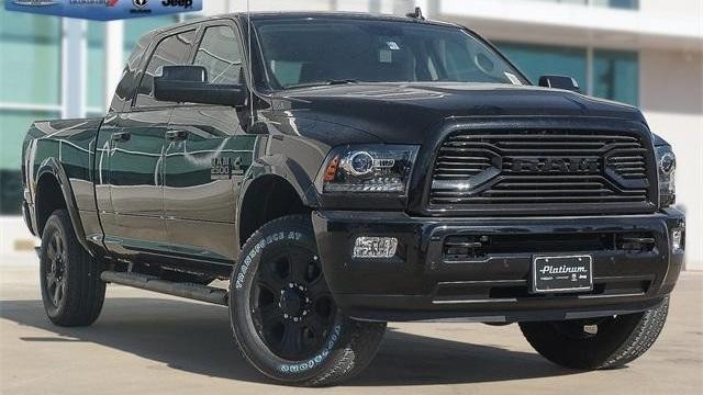 black truck in front of texas truck dealership