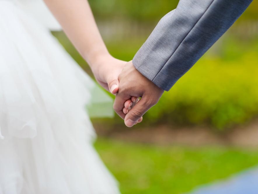 Bride and Groom Holding Hands