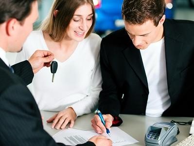 GM Dealer Financial Department Employee Assisting Prospective Buyers