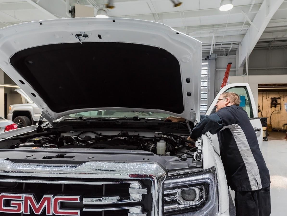 GMC battery on bench with tools