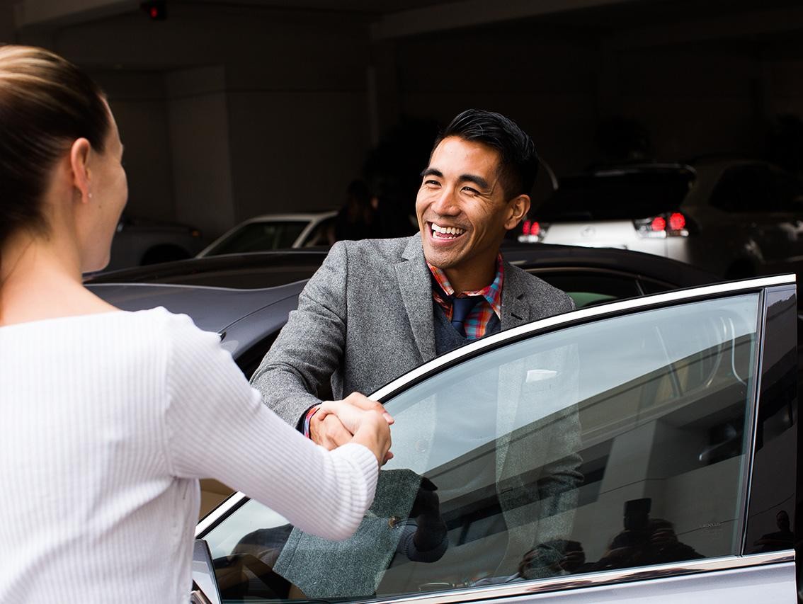 Man shaking hands with female salesperson