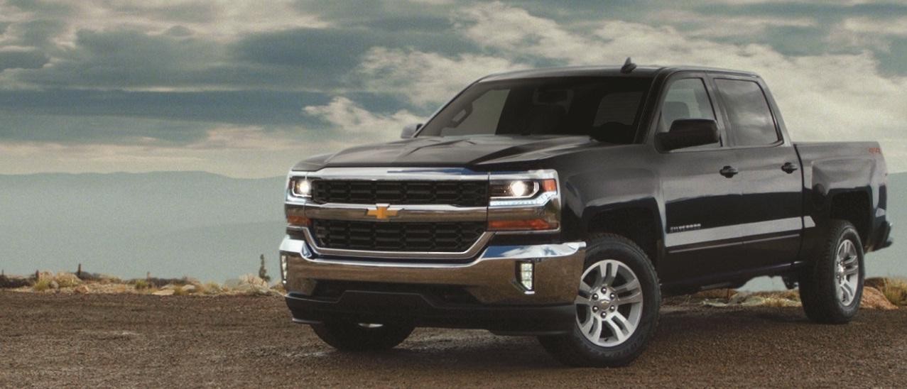 Black 2018 Chevy Silverado 1500 in Flatlands with Cloudy Skies