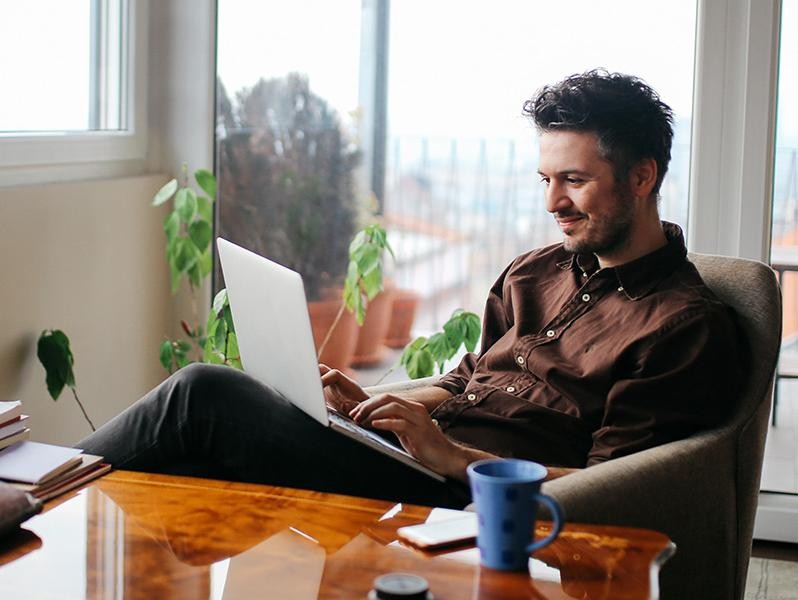 Man Surfing On the Laptop