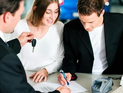 Finance Department Employee Working with Used SUV Purchasers