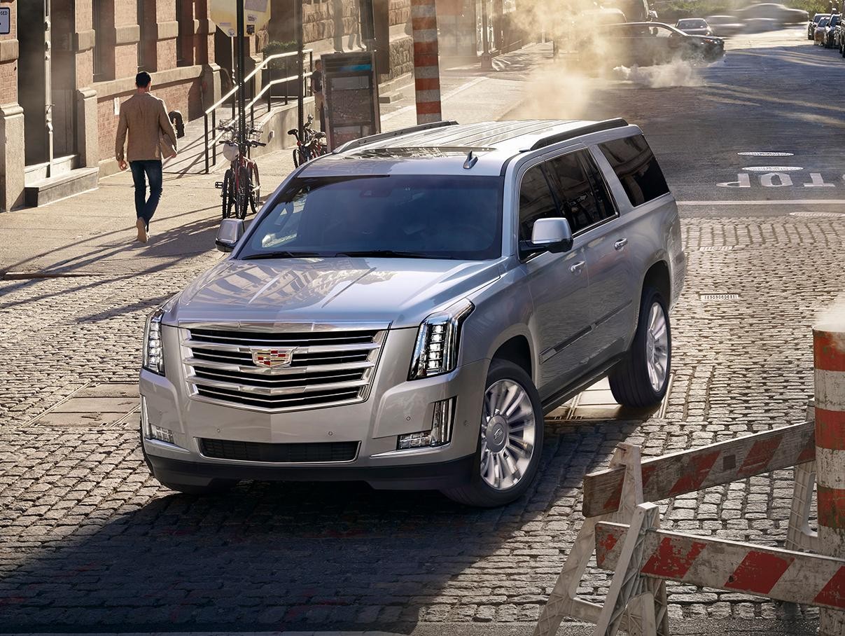 2018 Cadillac Escalade ESV | Lifestyle | Sunny Downtown Construction background