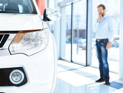 Prospective Vehicle Owner entering GM Dealer Showroom