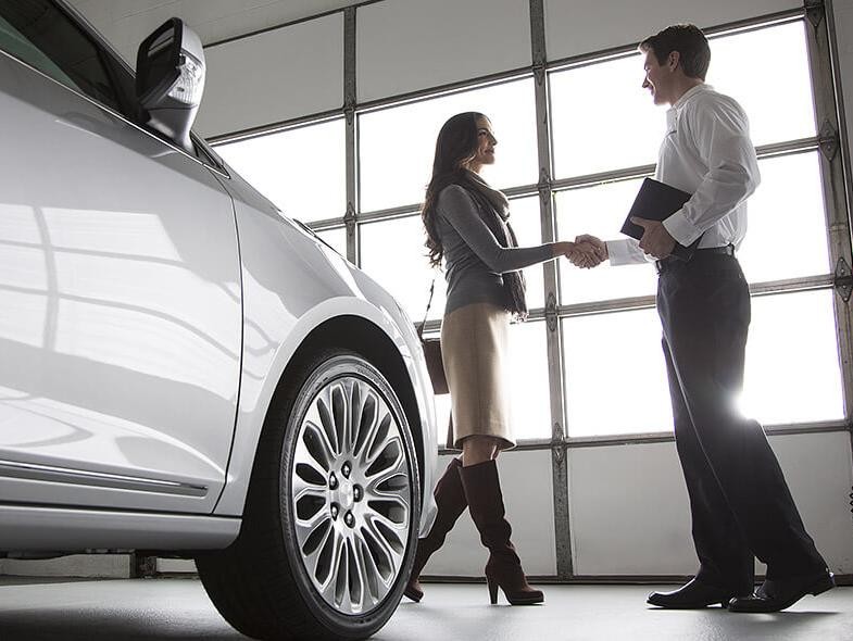 Salesman shaking hands with a new customer.