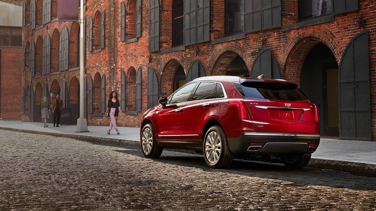 2018 Cadillac XT5 Crossover parked on city street.